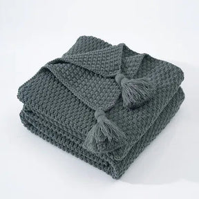 Elegante Wollstrickdecke mit Fransen